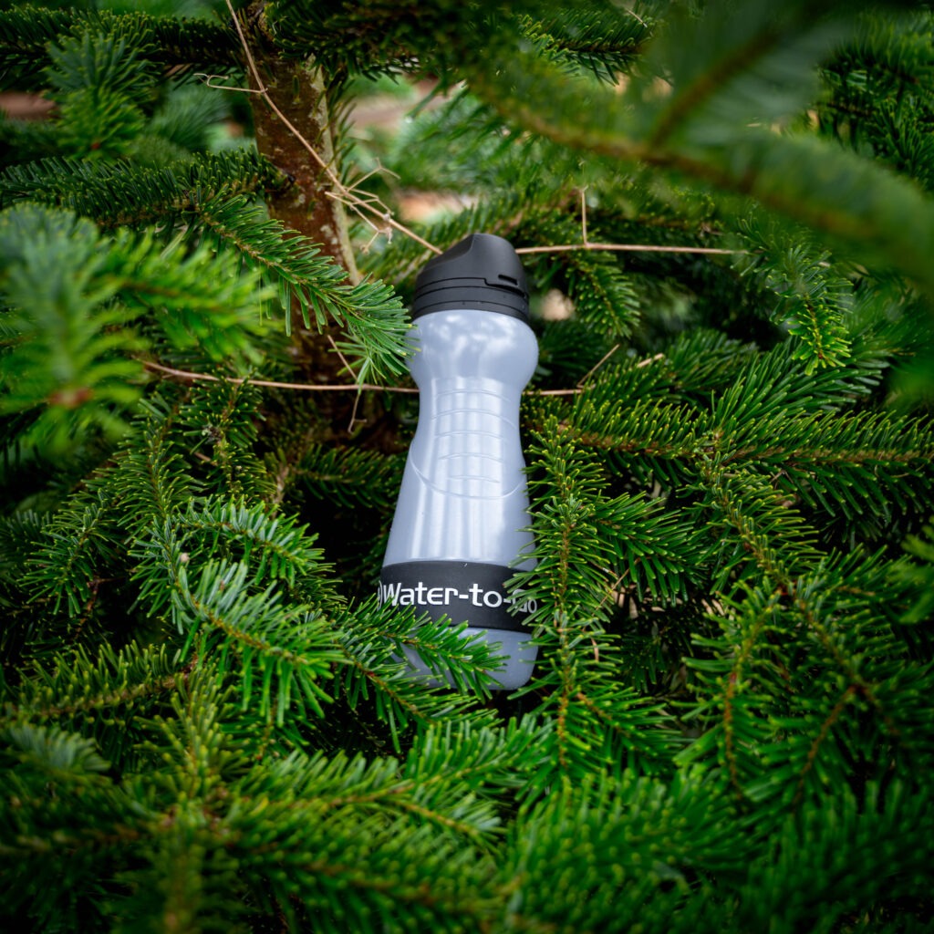550ml water purifier bottle in a green tree